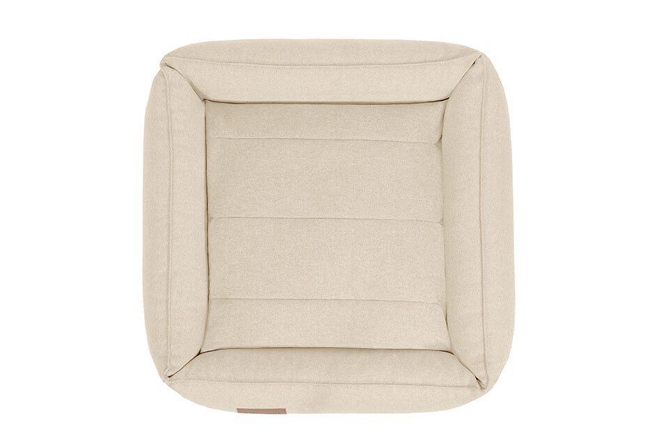 A BEIGE dog bed URBAN by Bowl&Bone Republic on a white background.