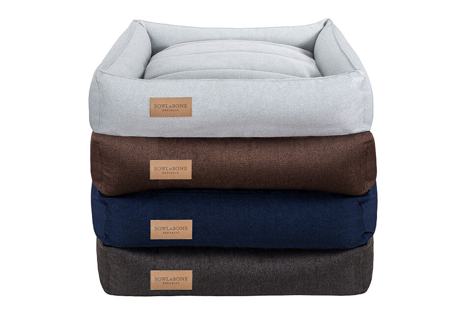 Four Bowl&Bone Republic dog beds stacked on top of each other.