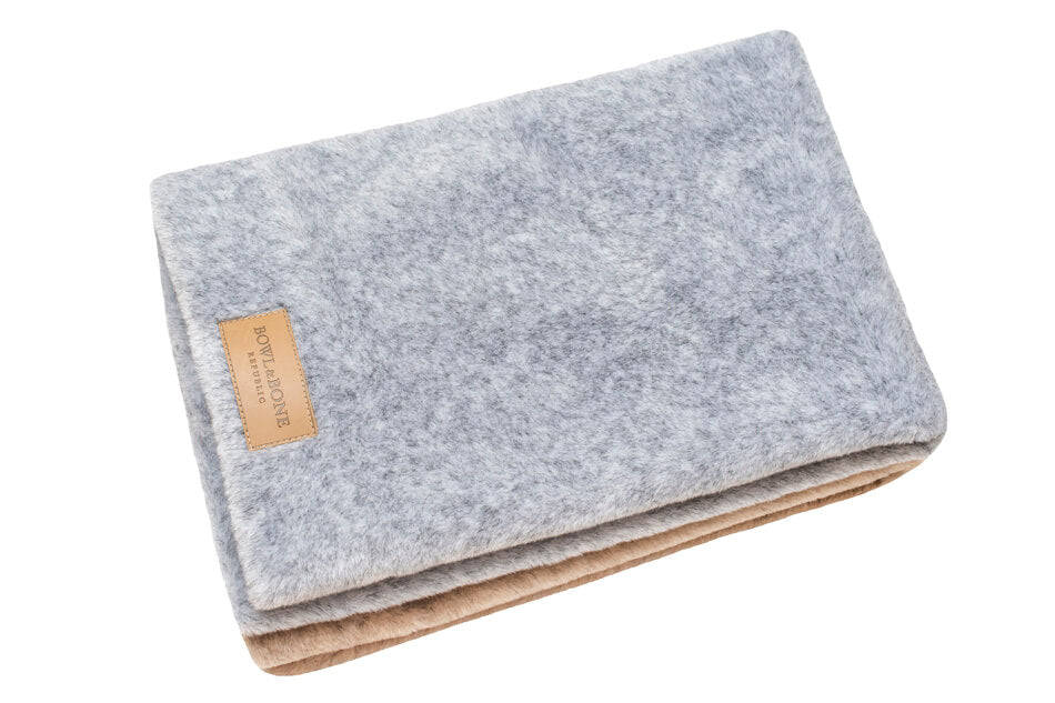 A grey and brown Bowlandbone Republic dog blanket NAP brown folded on top of each other.