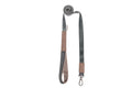 A Bowlandbone dog leash YETI brown with a grey and brown strap.
