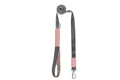 A pink and grey dog leash with a handle, called the dog leash YETI rose by Bowlandbone.