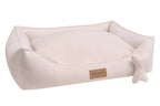 A Bowl&Bone Republic CLASSIC cream dog bed with a bone in it.