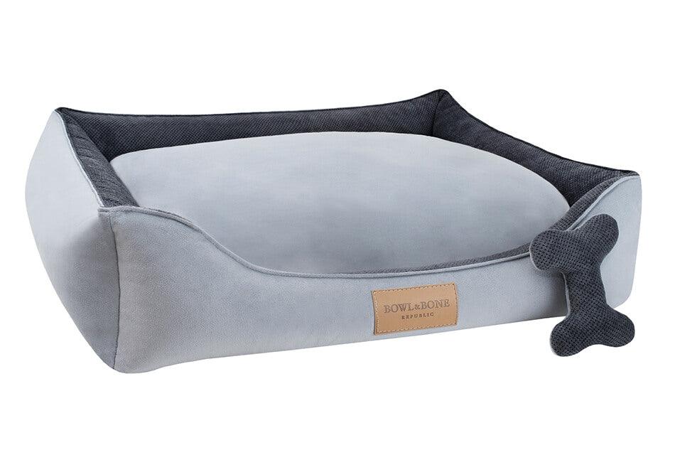 A Bowl&Bone Republic dog bed in CLASSIC grey with a bone on it.