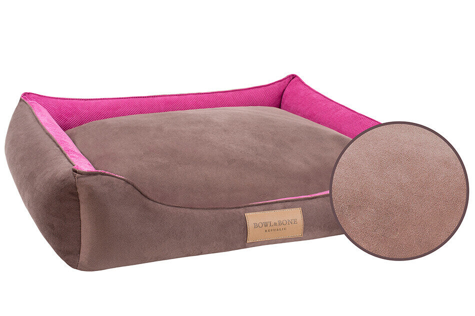 A classic pink Bowlandbone dog bed with a pink trim.