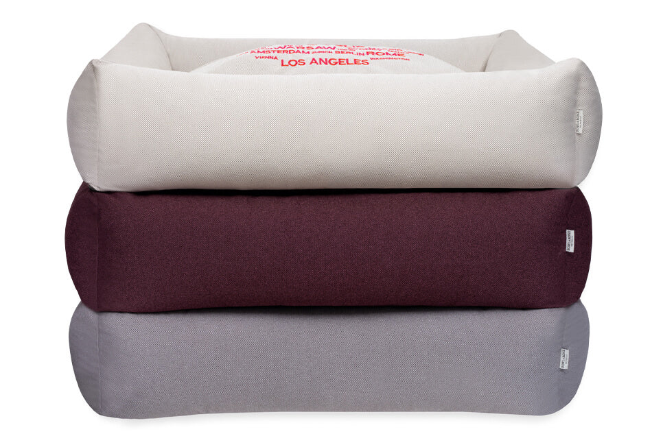 Three Bowl&Bone Republic dog beds, stacked on top of each other.