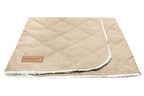 A dreamy Bowl&Bone Republic dog sleeping bag in cream on a white background.