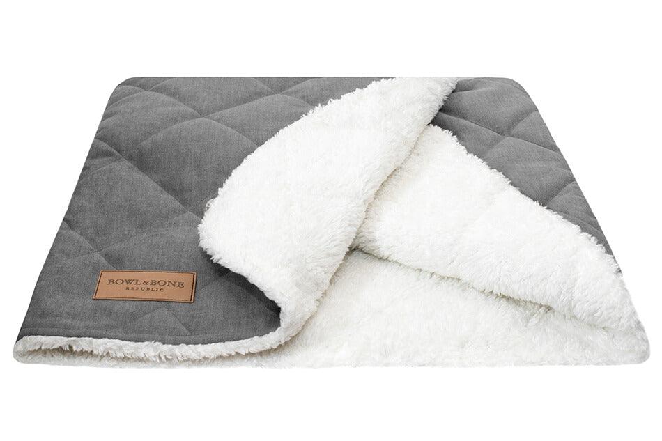 A dreamy Bowlandbone dog sleeping bag in silver from Bowl&Bone Republic on a white background.