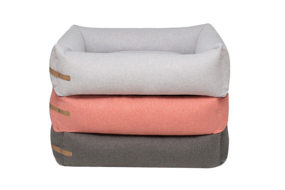 A stack of three Bowl&Bone Republic dog bed LOFT grey, pink and orange.