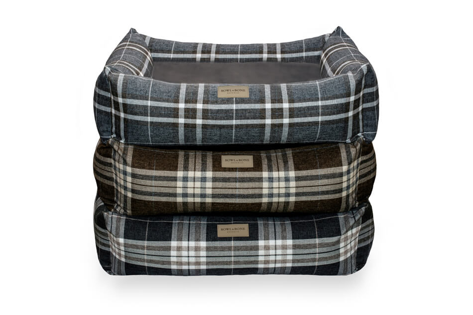 Three Bowlandbone SCOTT blue dog beds stacked on top of each other.