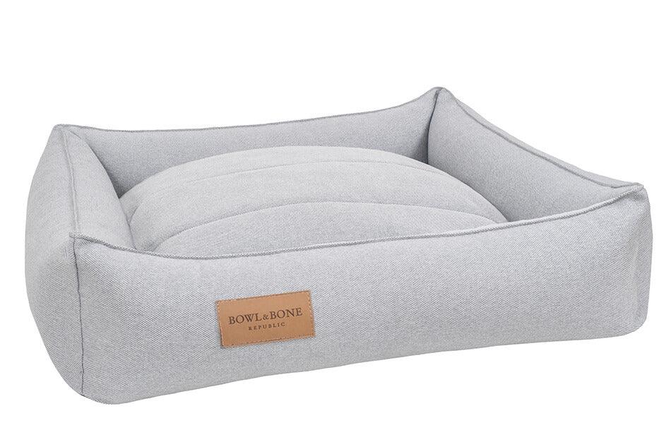 A dog bed URBAN grey with a leather label Bowl&Bone.