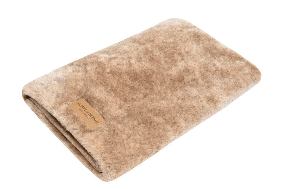 A Bowlandbone dog blanket NAP on top of a white background.