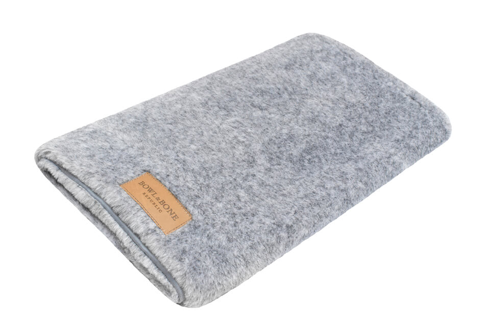 A Bowl&Bone Republic dog blanket with a leather label.