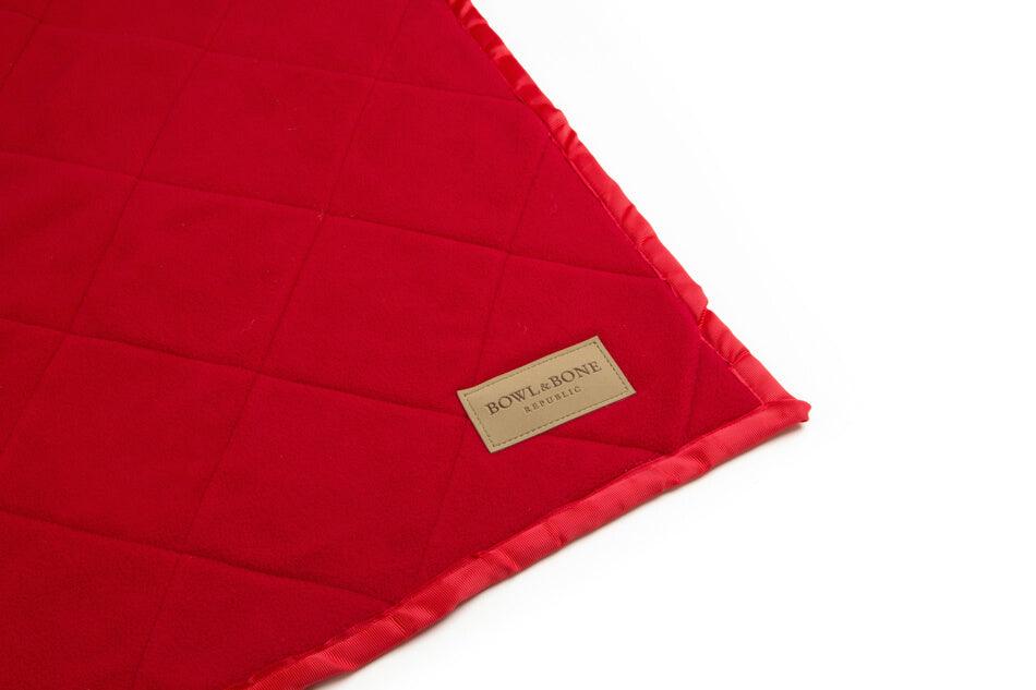 A Bowl&Bone Republic dog blanket on a white surface.