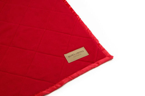 A Bowl&Bone Republic dog blanket on a white surface.