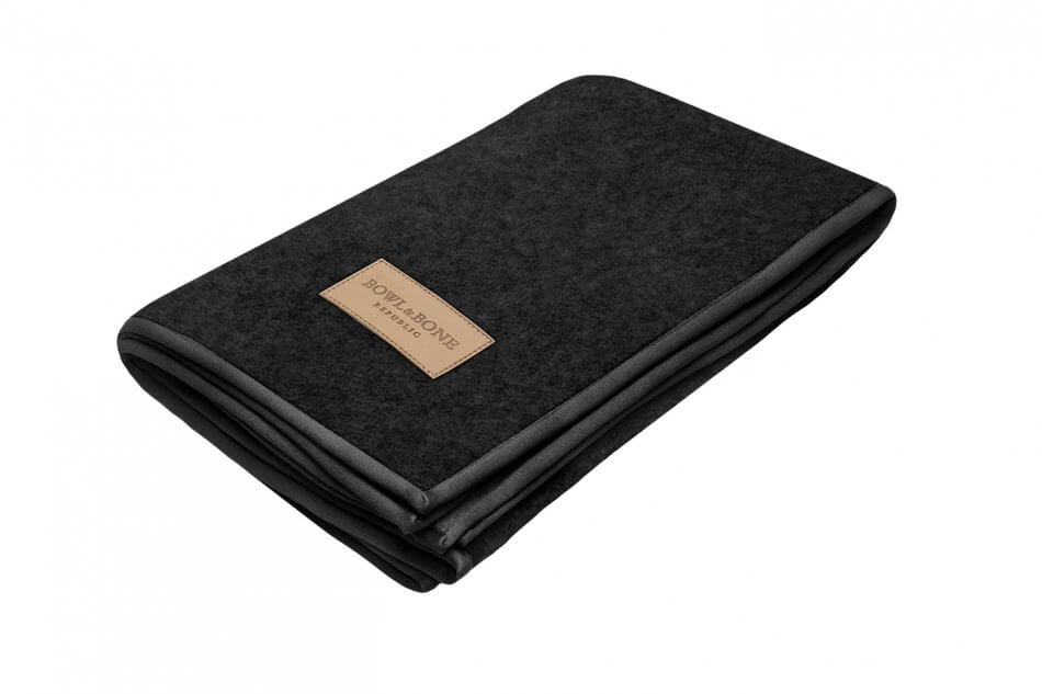 A black felt dog blanket with a tan Bowl&Bone Republic label.