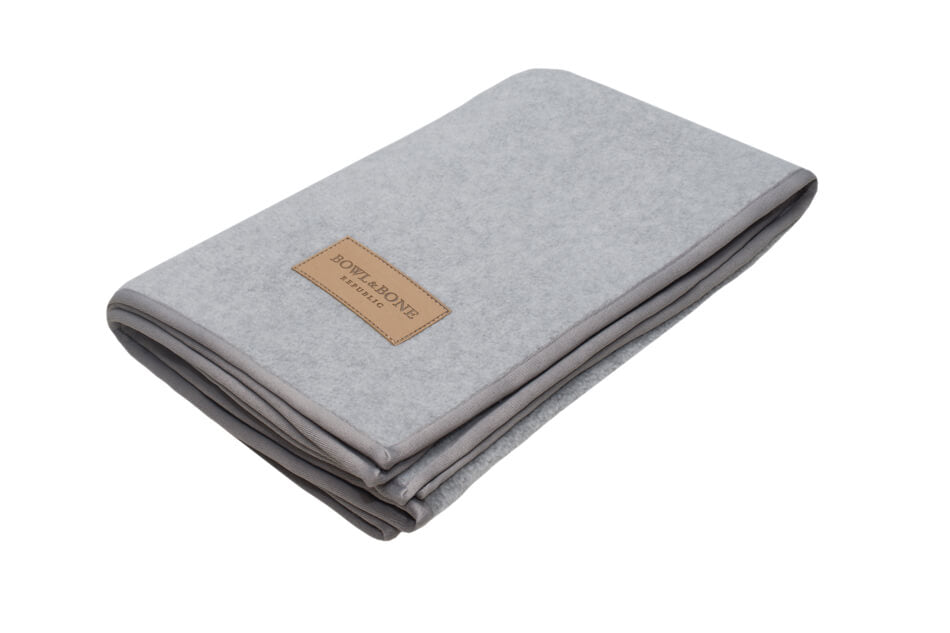 A Zen grey dog blanket with a brown label from Bowl&Bone Republic.