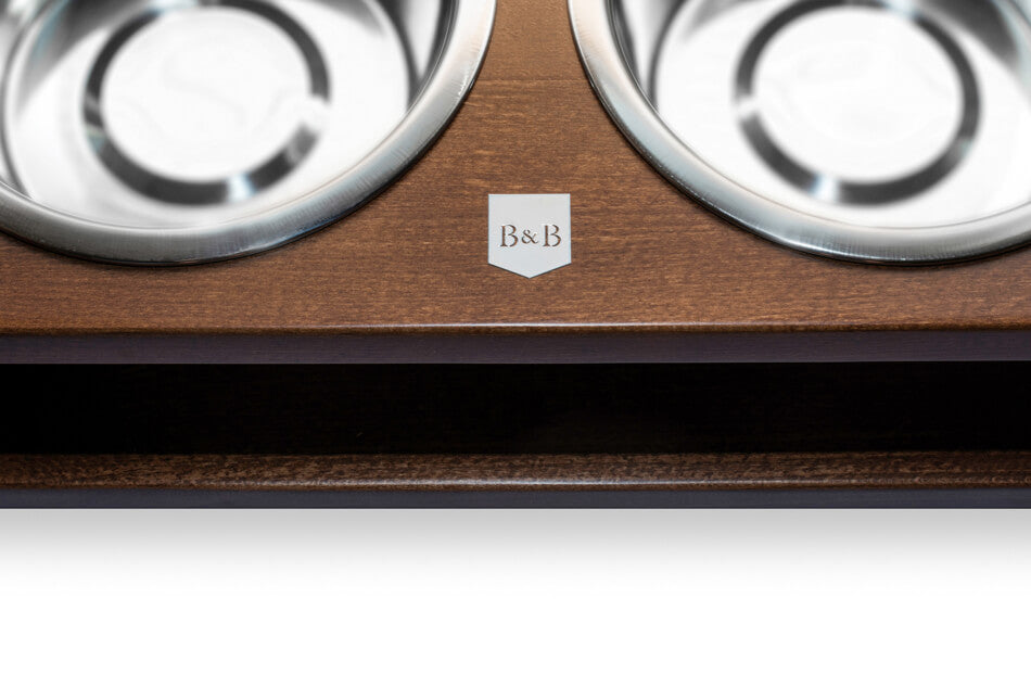 Two dog bowl DELI amber bowls by Bowl&Bone Republic on a wooden shelf.