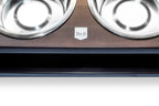 A dog bowl chestnut with two bowls on top of it by Bowl&Bone Republic.