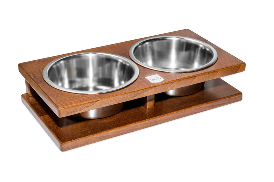 Two Bowl&Bone Republic dog bowl GRANDE amber bowls on a wooden stand.