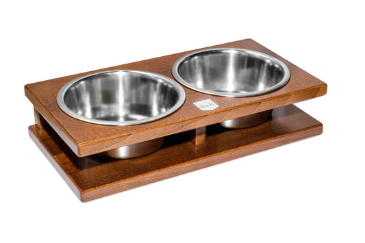 Two Bowl&Bone Republic dog bowl GRANDE amber bowls on a wooden stand.