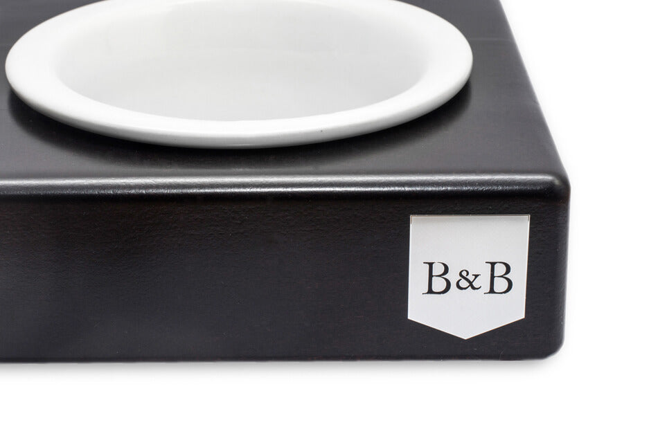 A black Bowl&Bone Republic box with a SOLO CERAMIC dog bowl in chestnut on top.