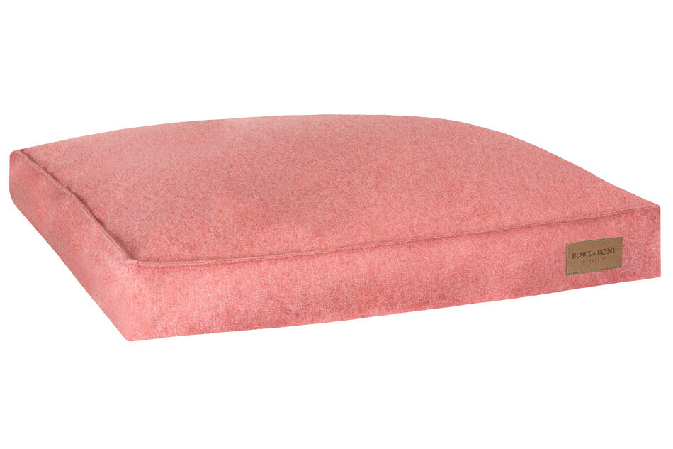 A LOFT coral Bowlandbone dog cushion bed featuring the Bowl&Bone Republic logo on a white background.