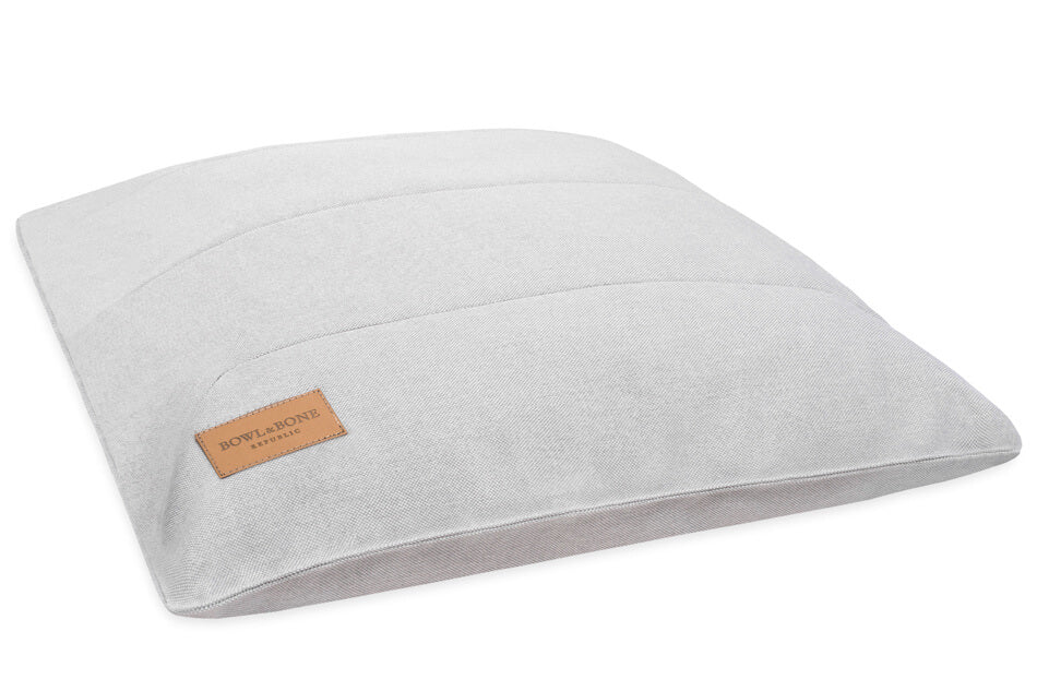 A Bowl&Bone Republic dog cushion bed in URBAN grey with a brown label.