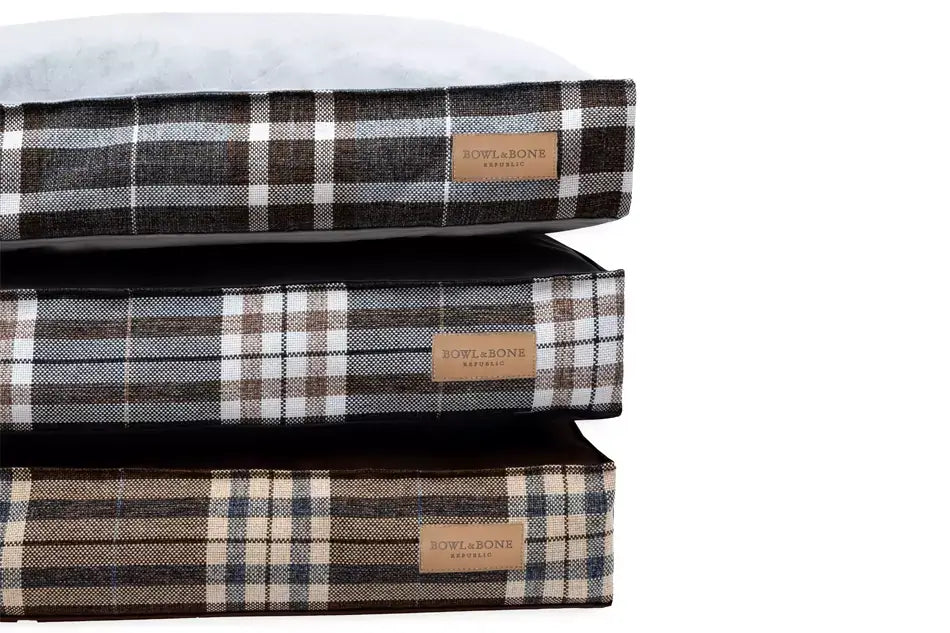 Three Bowl&Bone Republic dog cushion beds SCOTT brown stacked on top of each other.