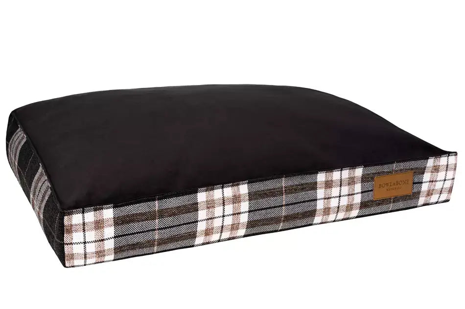 A black and brown plaid Bowlandbone dog cushion bed by Bowl&Bone Republic.