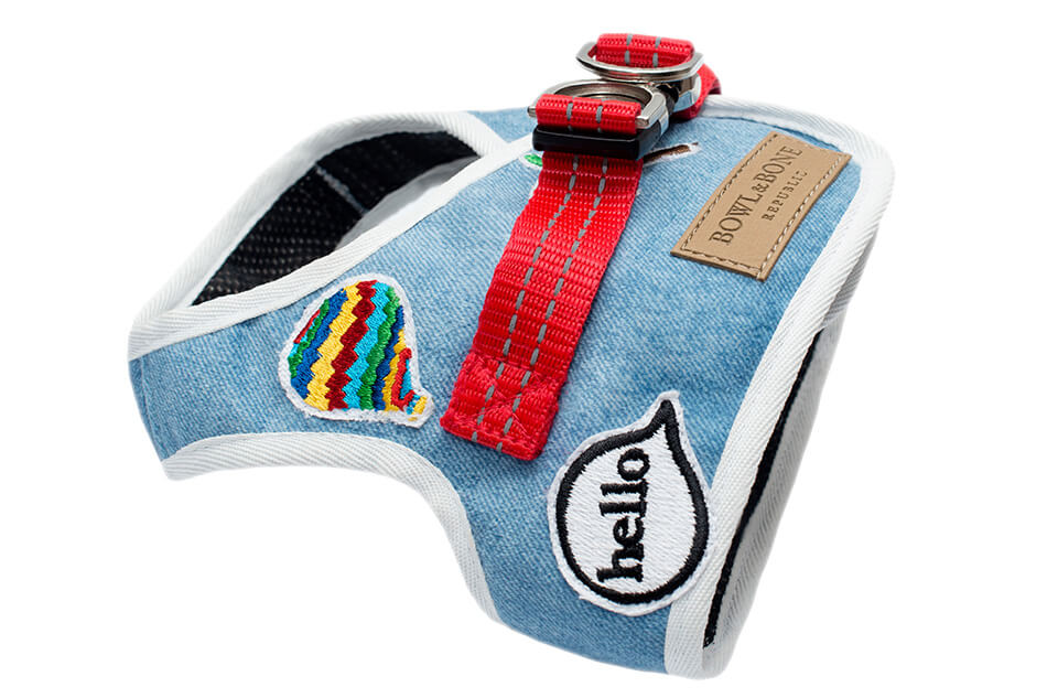A Bowl&Bone Republic dog harness DENIM blue with a patch on it that says hello.