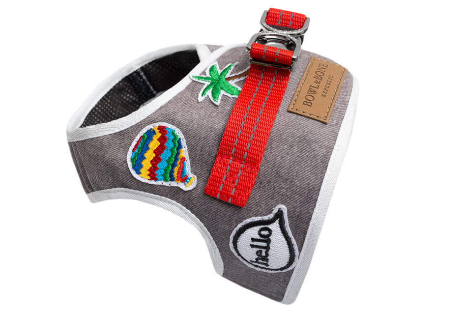 A Bowl&Bone Republic DENIM grey dog harness with patches on it.