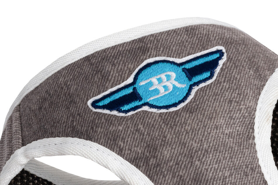 A Bowl&Bone Republic DENIM grey dog harness with a blue and white r logo.