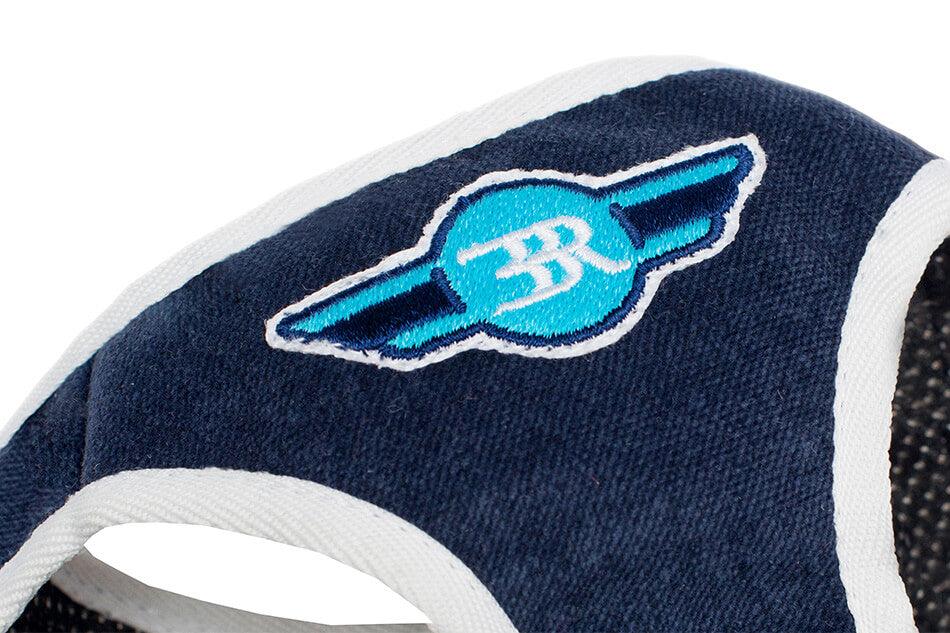 A Bowl&Bone Republic dog harness DENIM navy with a blue and white logo on it.