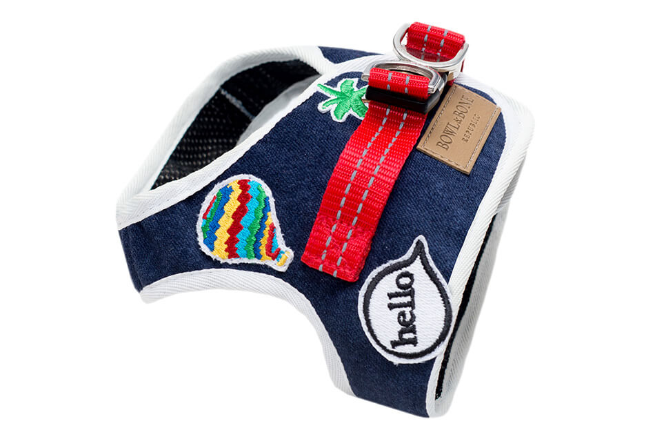 A Bowl&Bone Republic dog harness DENIM navy with a patriotic patch on it.