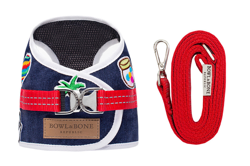 A Bowl&Bone Republic dog harness DENIM navy with a leash attached to it.