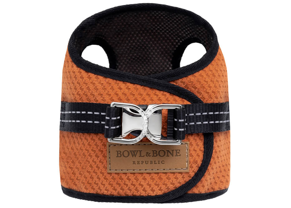 A Bowl&Bone Republic dog harness SOHO orange with a black buckle.