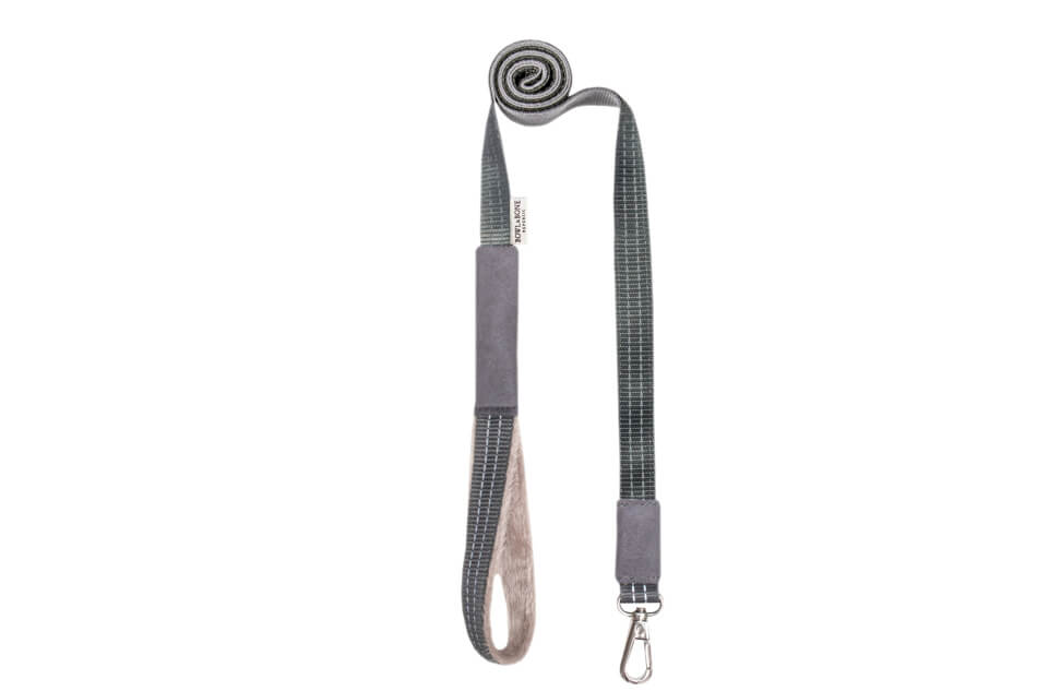 A dog harness with a handle attached to it from Bowl&Bone Republic in YETI grey.