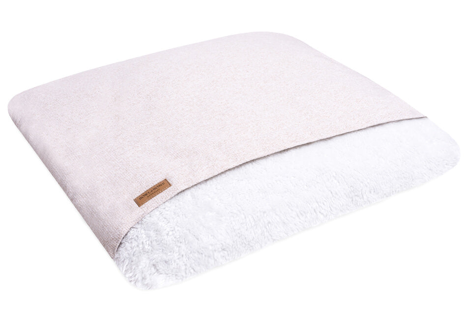 A pink and white dog sleeping bag by Bowl&Bone Republic on a white background.