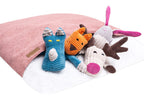 A group of Bowl&Bone Republic dog sleeping bags BLISS pink laying on a pink blanket.