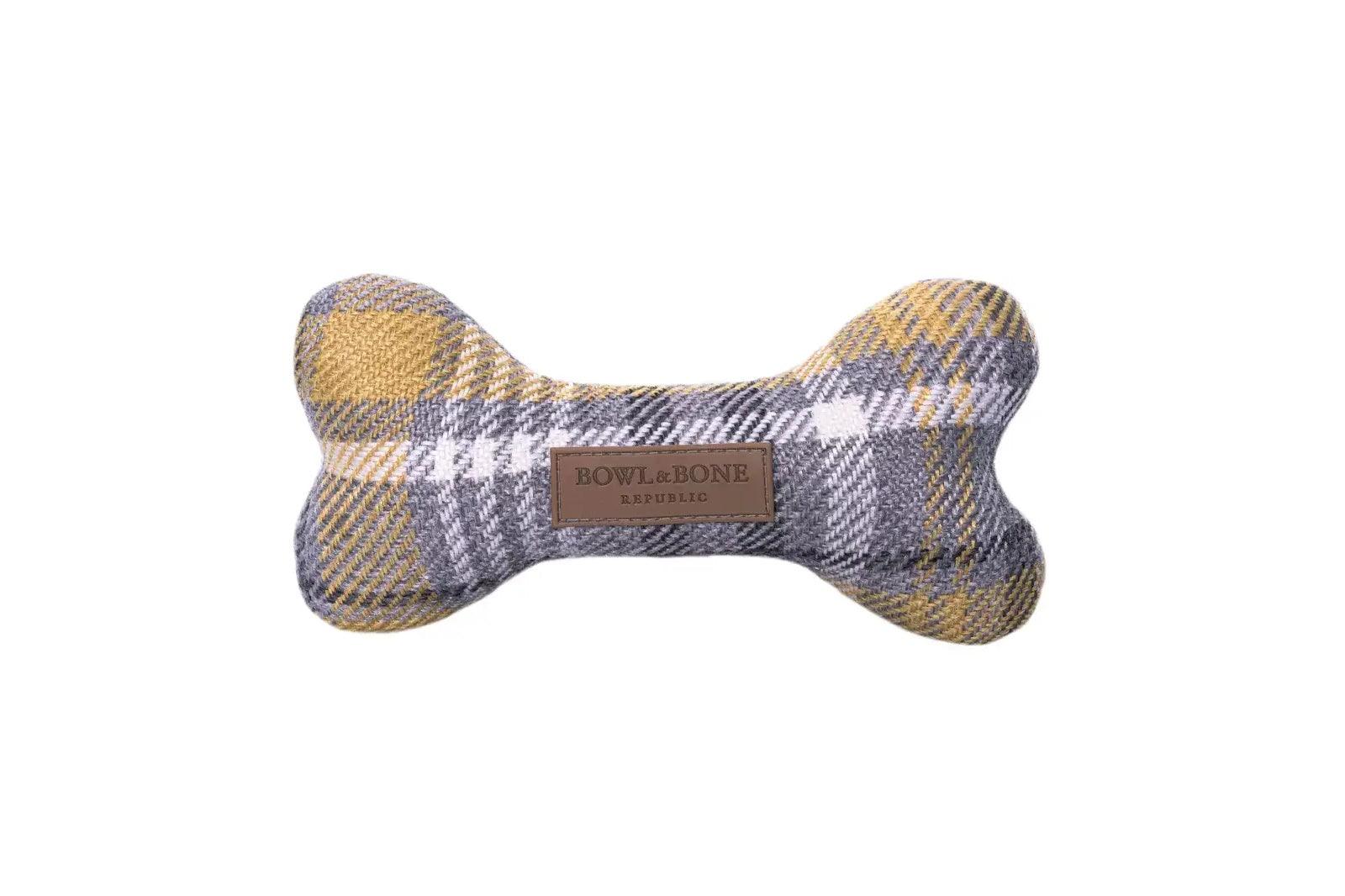 A yellow and grey plaid Bowl&Bone Republic dog toy BONE.