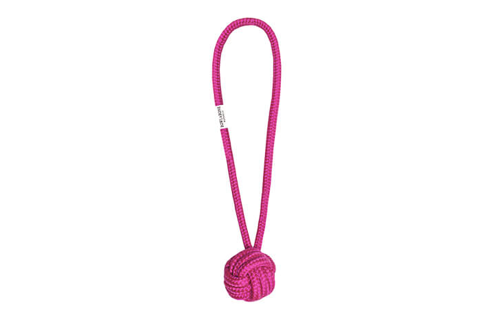 A Bowlandbone Republic pink rope toy with a knot on it.