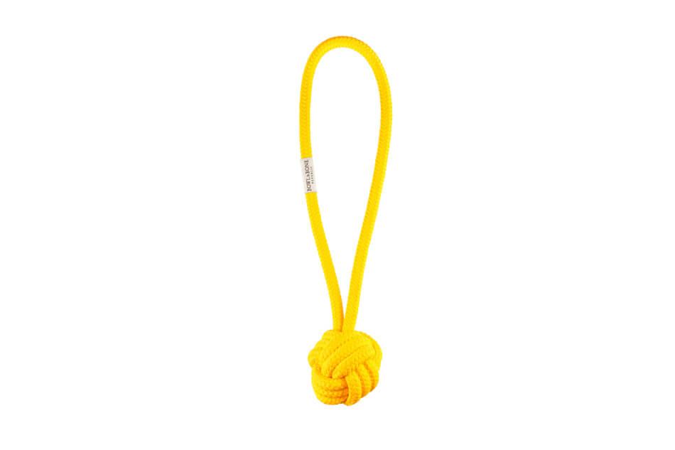 A Bowl&Bone Republic BULLET yellow rope with a knot on it.