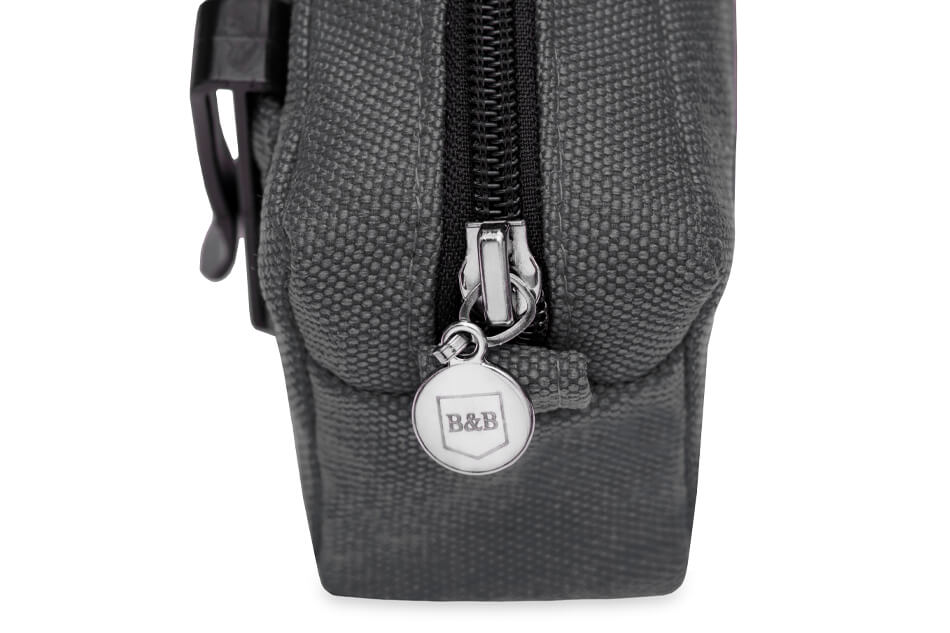 A Bowl&Bone Republic dog treat bag MIDI graphite with a zipper on it.