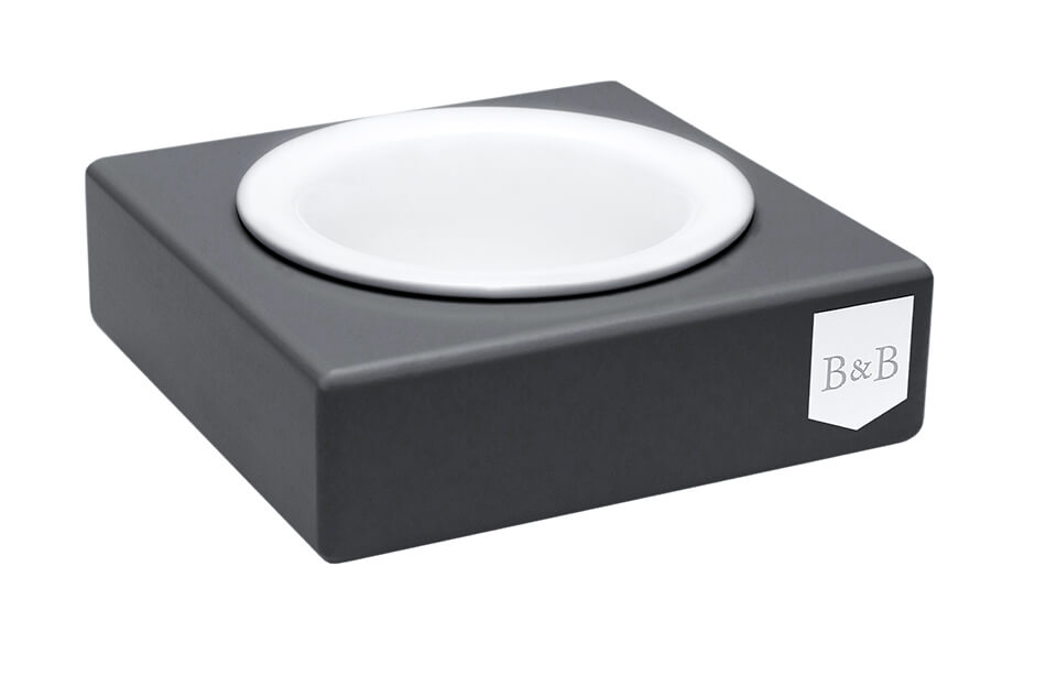 A grey dog bowl by Bowl&Bone Republic with a white dog bowl on top.