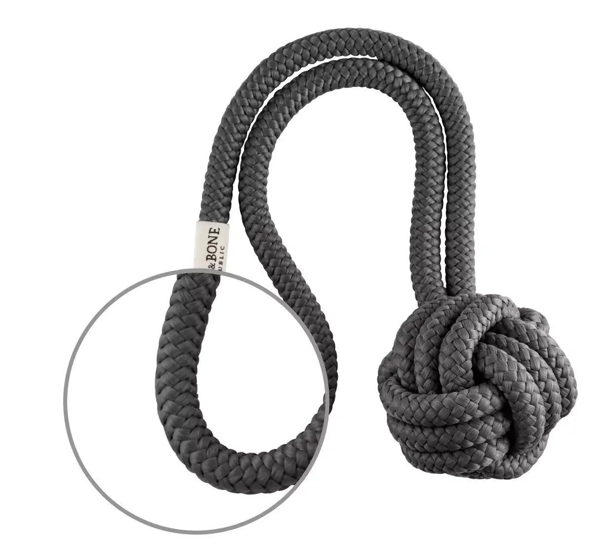 A grey dog toy with a knot on it by Bowlandbone.