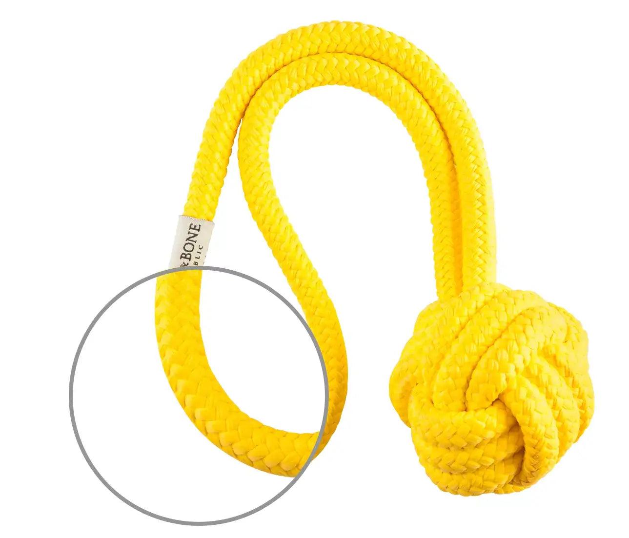 A yellow rope with a circle in the middle, dog toy from Bowl&Bone Republic.